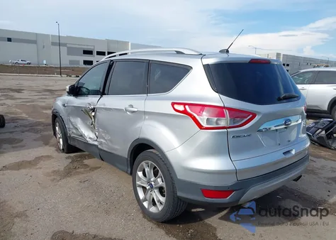 2016 Ford Escape Titanium z USA, uszkodzony, nr VIN 1FMCU0J91GUB70915